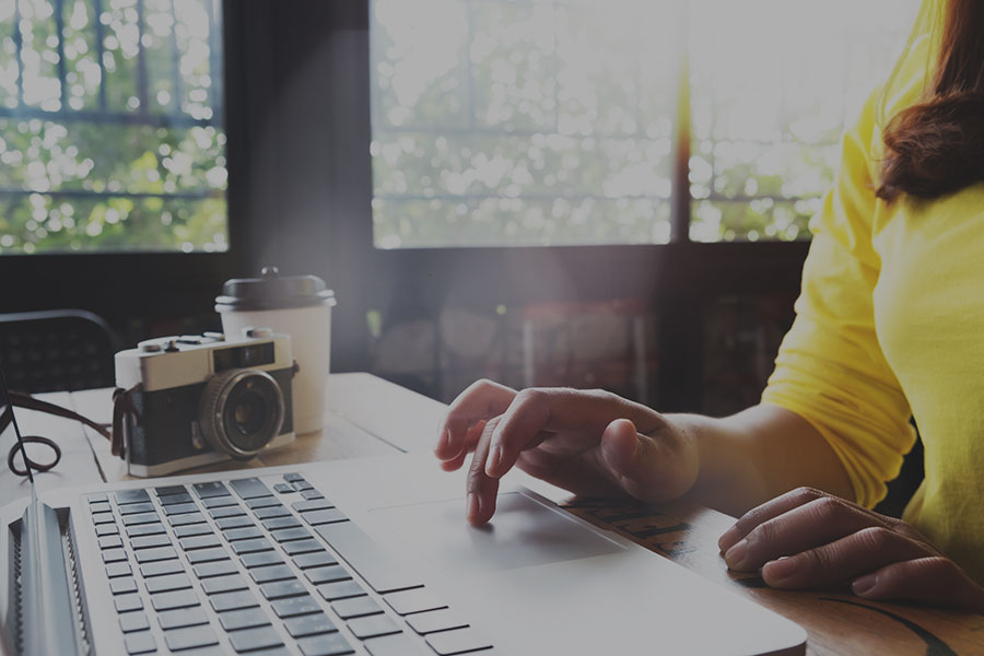 a person using a laptop for content creation