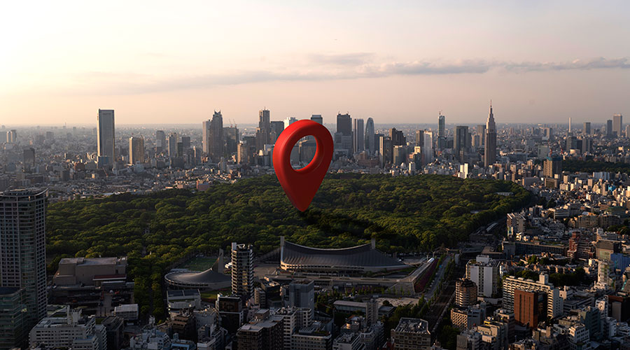 A large map pin in the middle of a park