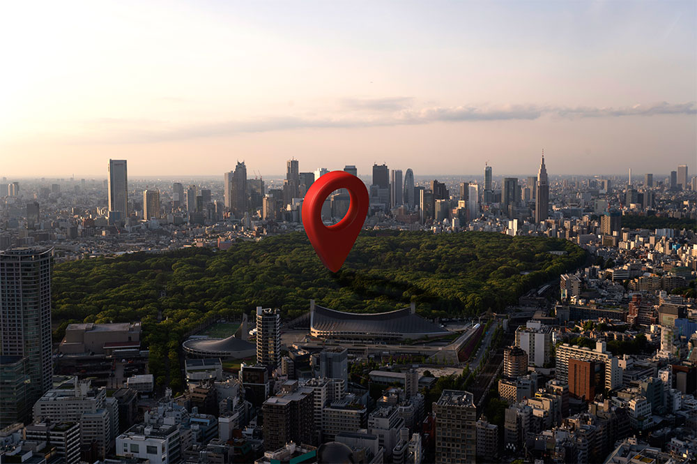 A large map pin in the middle of a park