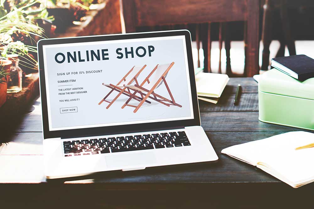 A laptop showing a landing page for an online shop