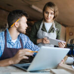 2 people over a laptop looking into SEO for small business