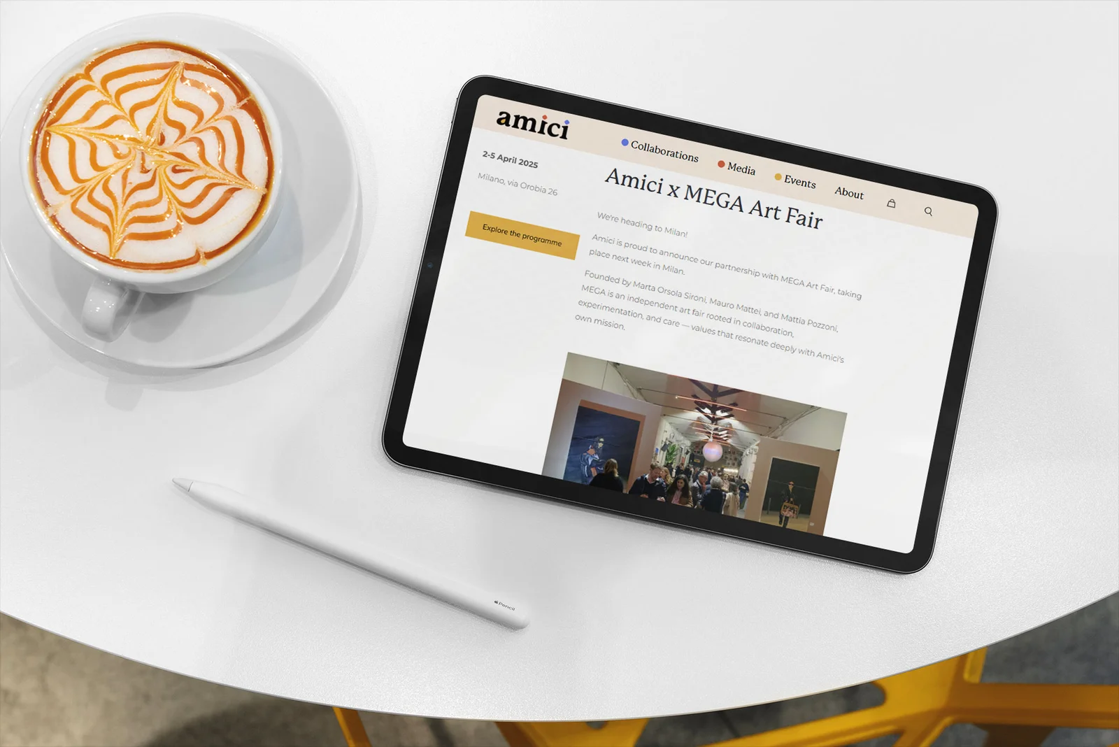 A tablet showing Amici's website
