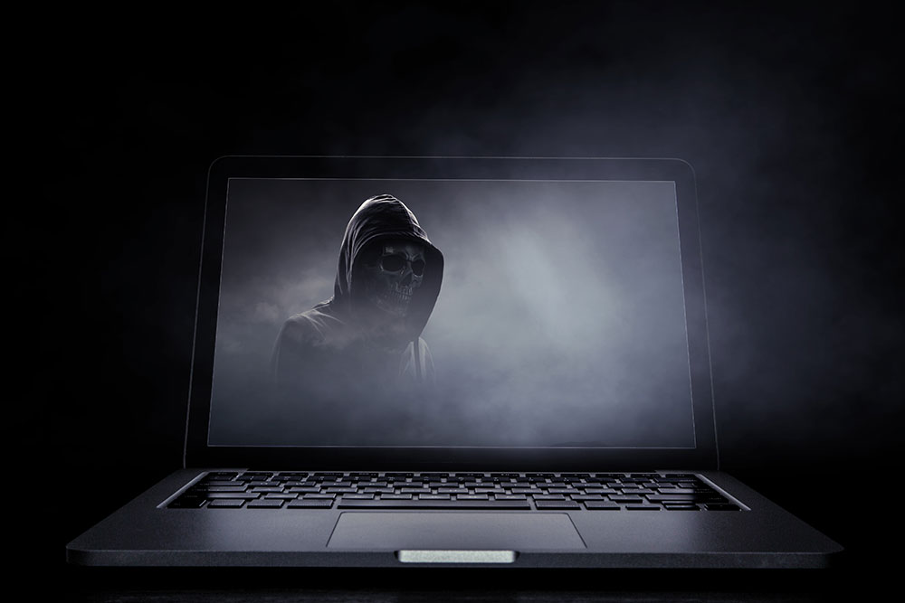 A laptop with the grim reaper on the screen to represent a neglected website