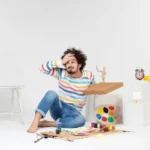 A frustrated man having to paint something he doesn't know how to