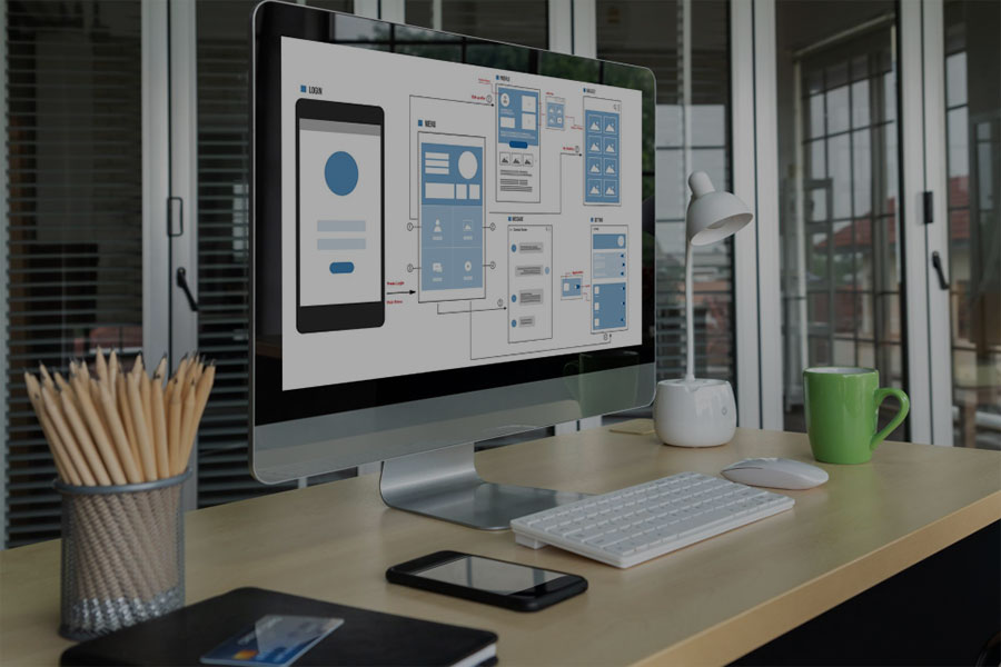 A monitor showing web design wireframing for a mobile website