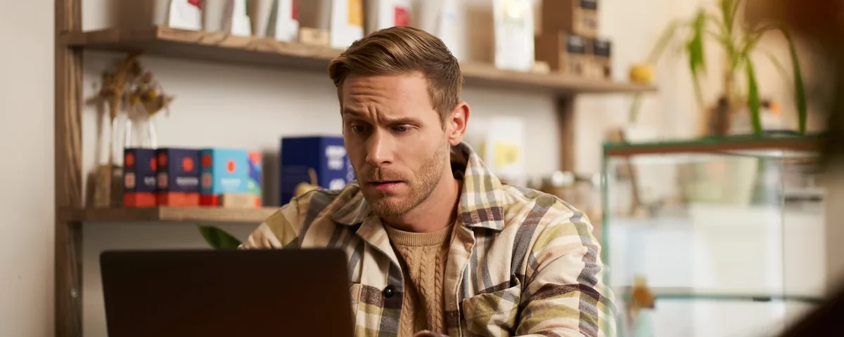 A business owner finding their Google Business Profile suspended on a laptop