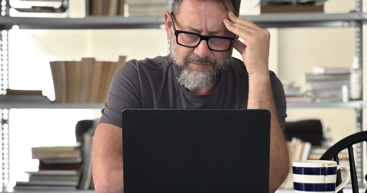 A business owner finding their Google Business Profile suspended on a laptop