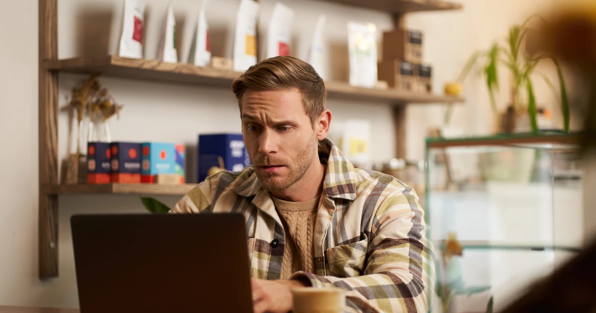 A business owner finding their Google Business Profile suspended on a laptop